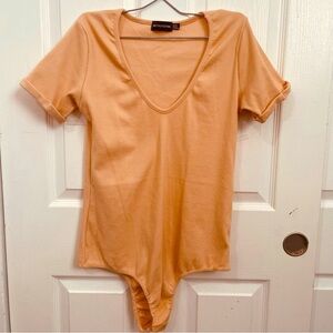 Pretty Little Thing Bodysuit light peach size 14